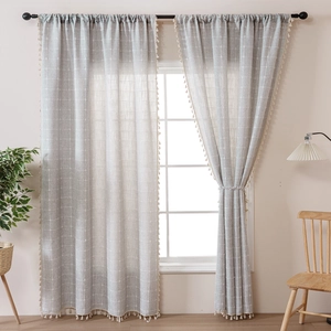 Modern grey and white plaid linen curtains with tassels for a minimalist living room decor