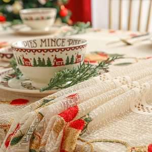 Christmas lace tablecloth with bell embroidery and festive holiday dining scene setup