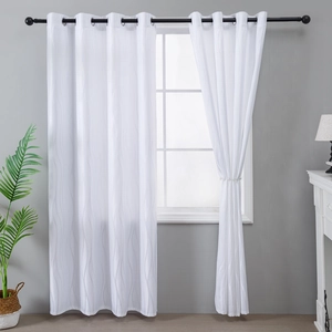 White grommet curtains with vertical wave texture for a minimalist living room