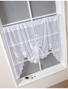 Detailed close-up of white floral lace cafe curtain with delicate scalloped edge