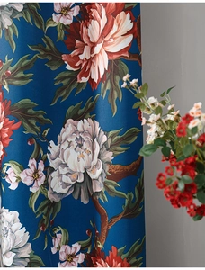 Detailed macro view of midnight blue velvet curtain with elegant peony floral pattern