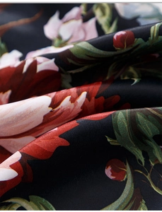 Macro detail of luxurious black satin curtain fabric with red peony oil painting floral print