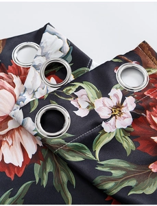 Detail of metal grommets and vintage floral pattern on heavy blackout curtains