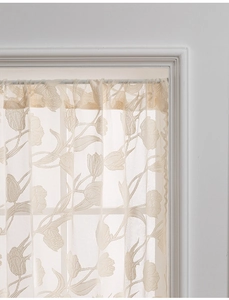 Detailed close-up of beige tulip lace door curtain with delicate floral mesh pattern