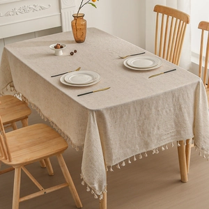 Minimalist beige linen tablecloth with white cotton tassels for modern home decor