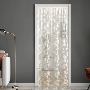 Modern beige tulip lace door curtain in a minimalist living room setting with soft lighting