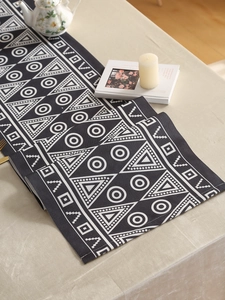 Detailed close-up showing woven texture and geometric patterns of the waterproof table runner