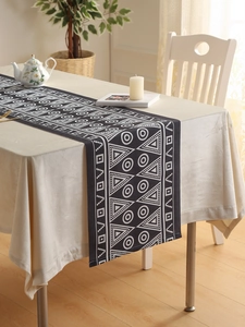 Close-up of geometric black and white table runner with waterproof bohemian fabric texture