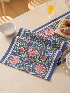 Detailed macro view of the dark blue floral fabric texture with classic peony patterns