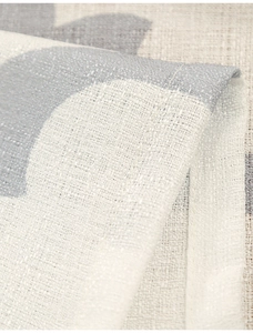 Close-up of thick polyester fabric showing grey gourd flower pattern and weave texture