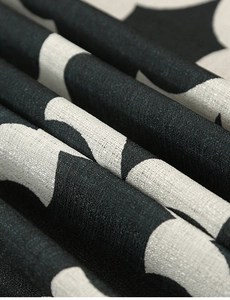 Close-up of black and white gourd pattern polyester fabric with micro-wrinkle texture