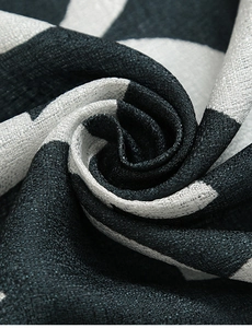 Macro view of black and white geometric gourd flower curtain with textured linen weave