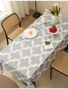 Gray Moroccan trellis pattern thick polyester tablecloth on a modern dining table