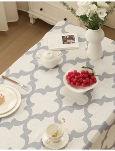Detail of grey clover geometric pattern on thickened polyester dining tablecloth