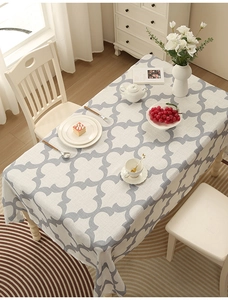 Close-up of thick polyester tablecloth with grey and white clover geometric patterns