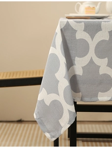 Detail of grey geometric pattern polyester tablecloth with premium woven texture and drape