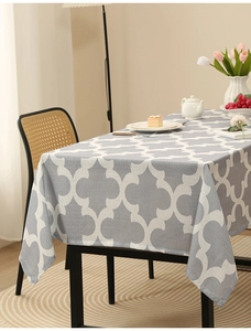 Detail view of grey clover pattern on thick polyester fabric tablecloth for home dining decor