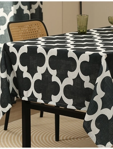 Detail of black and white Moroccan trellis pattern tablecloth with premium fabric texture
