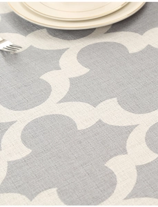 Macro detail of grey quatrefoil pattern polyester tablecloth with thick linen-like texture