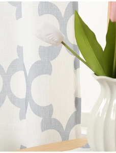 Detail of grey geometric ring pattern on white linen textured semi-blackout curtain