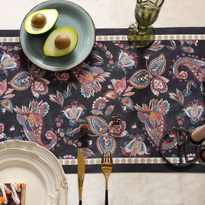 Modern black floral table runner with colorful paisley patterns and waterproof fabric