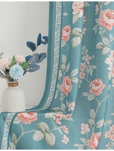Detail of teal faux linen curtain fabric with pink rose prints and white lace edge