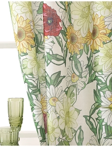 Detail shot of modern floral print curtains with vibrant daisies and textured fabric