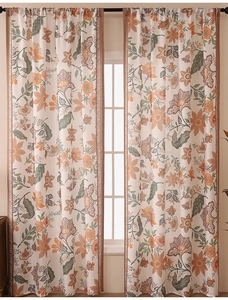 Detailed texture of botanical linen-blend curtains with retro floral patterns and dark piping