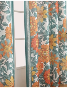 Detailed texture of semi-blackout fabric with orange and yellow floral plant patterns