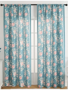 Detail of floral curtains with pink roses and green leaves on high-quality linen texture