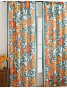 Detailed close-up of retro floral linen curtain with warm orange blooms and grey leaves