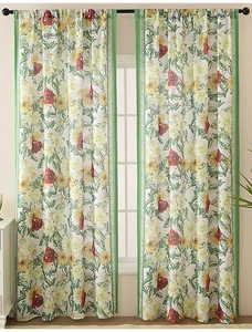 Detail of floral linen curtains with poppy and sunflower prints on white fabric