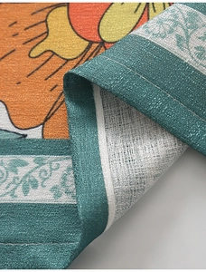 Macro detail of high-quality linen fabric with vibrant floral print and fine stitching