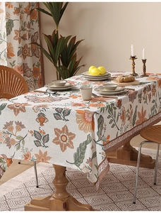 Close-up of bohemian floral tablecloth showing thick linen texture and vintage patterns