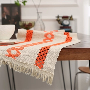 Modern minimalist cotton linen table runner with geometric orange weaving and tassels