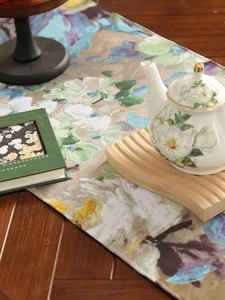 Close-up of artistic purple floral print on premium thick linen textured table runner