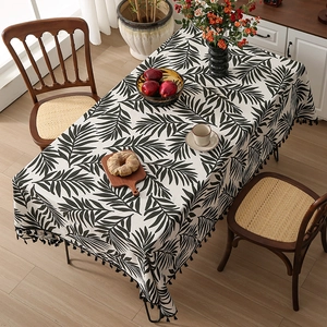 Nordic cotton linen tablecloth with black palm leaf prints and elegant tassel edges
