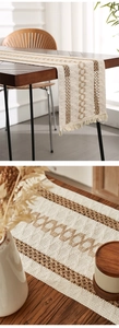 Close-up of bohemian linen table runner with geometric weaving and fringe details