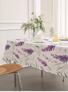 Detailed view of lavender floral patterns on a rustic rectangle fabric tablecloth