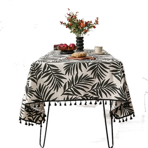 Nordic cotton linen tablecloth with black palm leaf prints and elegant fringe tassels