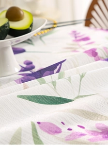 Detail view of breathable mesh fabric with purple lavender and green leaf print
