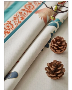 Detailed view of thick waterproof linen tablecloth with crane and floral pattern