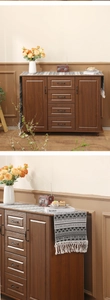 Detail of vintage wooden storage cabinet with four drawers and black metal handles