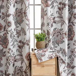 Detail of floral blackout curtains with elegant vintage flower pattern on beige fabric