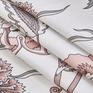Detail of blackout fabric with vintage floral patterns in dusty pink and grey tones