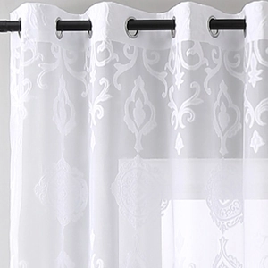 Close-up of white lace curtain with damascus embroidery and silver grommet rings