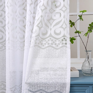 Detailed embroidery of white lace sheer curtain with floral and geometric patterns
