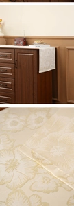 Close-up of vintage floral embroidery and silky texture on this elegant beige table runner