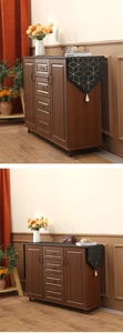 Walnut wood sideboard detail featuring four drawers and vintage curved black handles