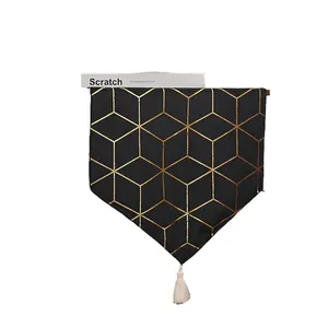 Nordic black table runner with golden geometric patterns and white fringe tassels